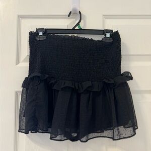 Black ruffle mini skirt